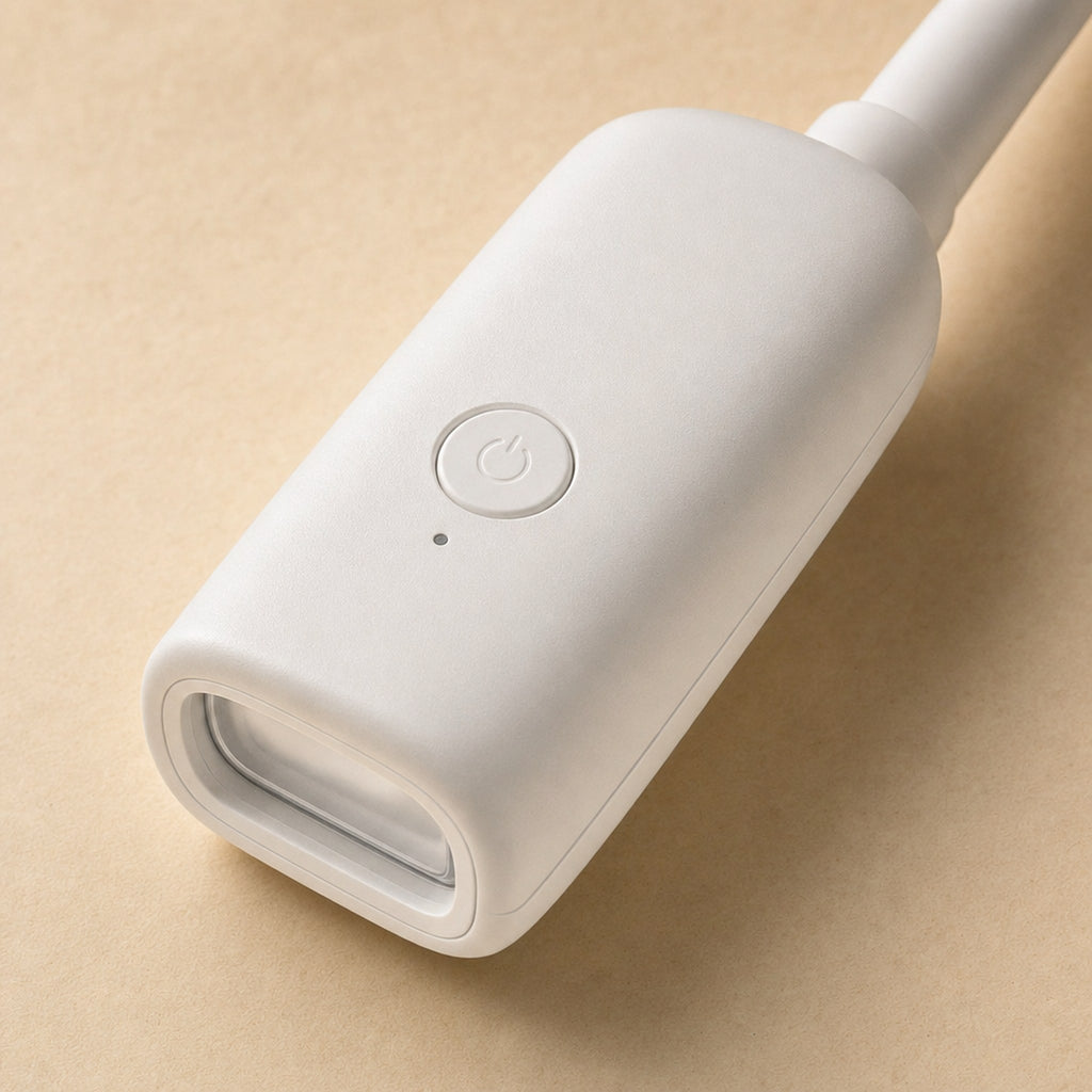 Close-up of a GlimGlow lamp head showing its single control button and LED lens
